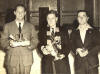 1947 Liffey Swim: Photograph of the prizewinners afterwards taken at the Tara Baths. In the centre is the winner Kenneth Ruddock. To the left is Patrick Condon who came 2nd. To the right is Bertie Collinge who came third.